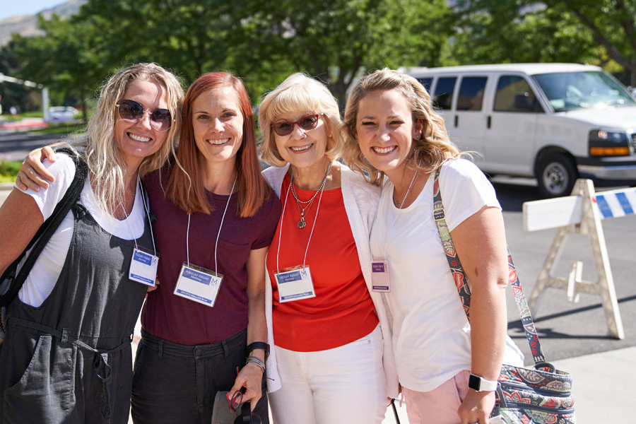 Four female Education Week attendees posing for photo