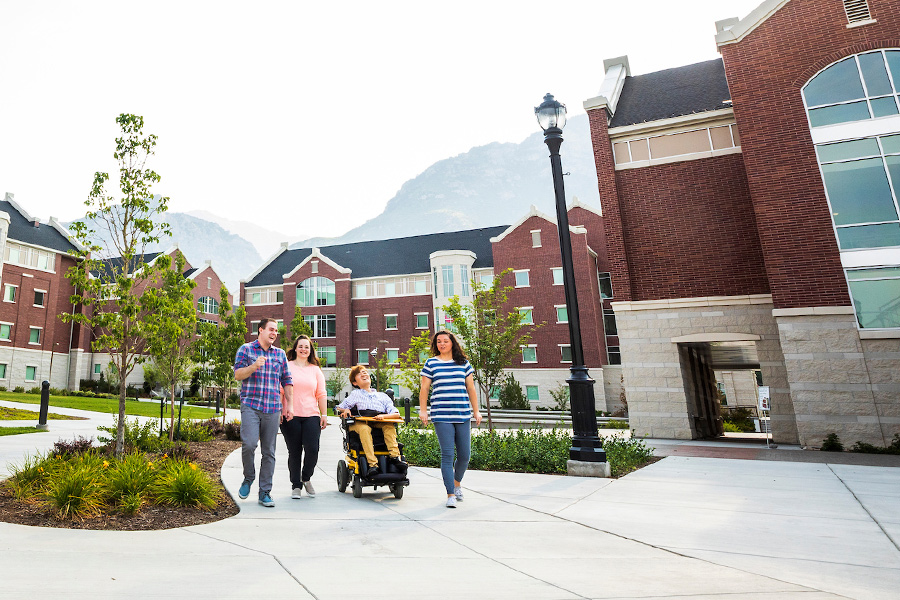 Ed Week participants on sidewalk near Heritage Halls